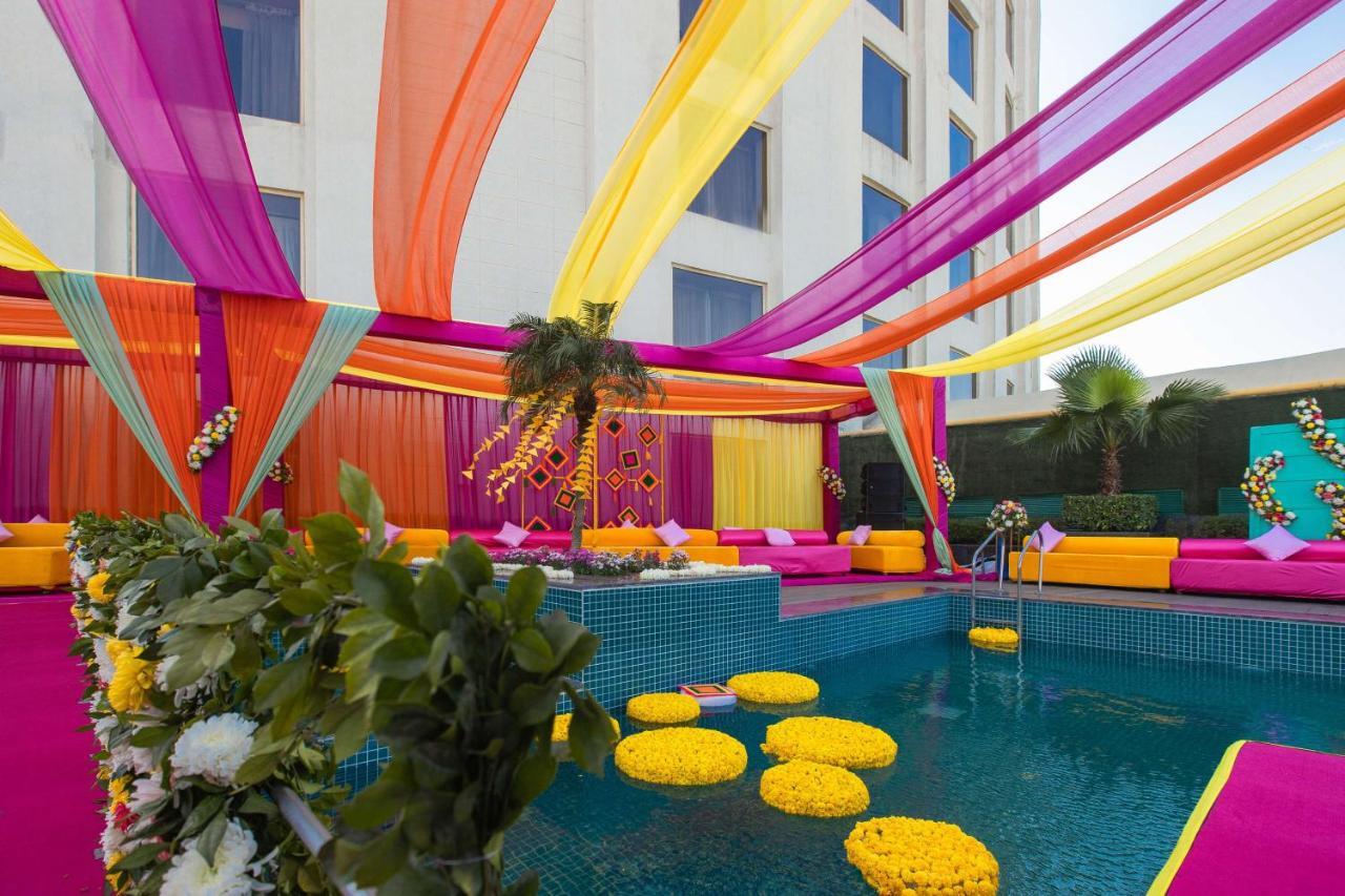 Radisson Blu Hotel New Delhi Dwarka Экстерьер фото A poolside wedding in India